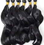 Six black body wave hair bundles arranged together
